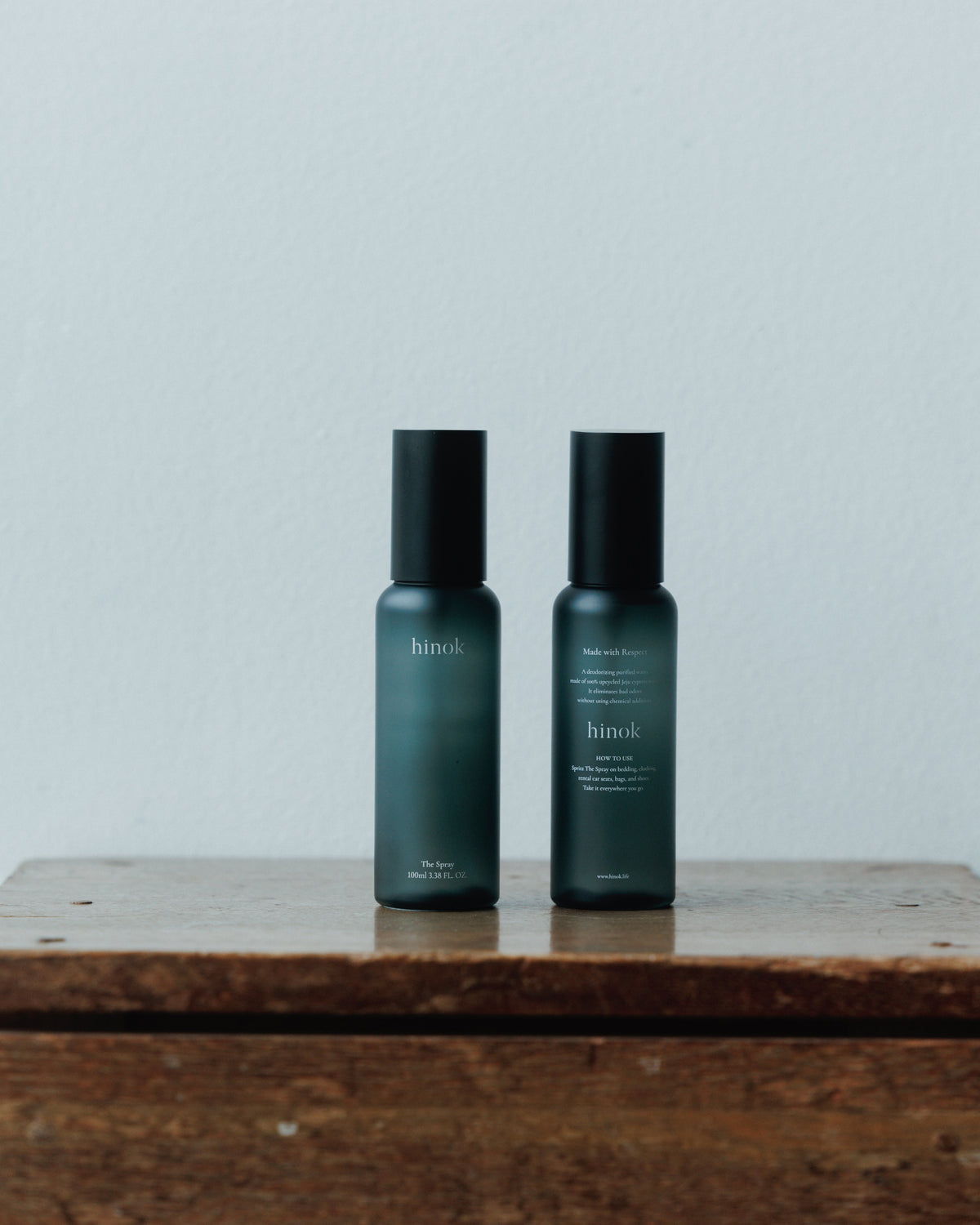 Two bottles of hinok The Spray in travel size.