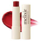 Melixir vegan lip butter with red lipstick on a white background