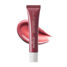 Melix Vegan Lip Treatment + Collagen lip balm in a rose pink squeeze tube with a white cap, shown in front of a glossy pink lip smear on a white background.