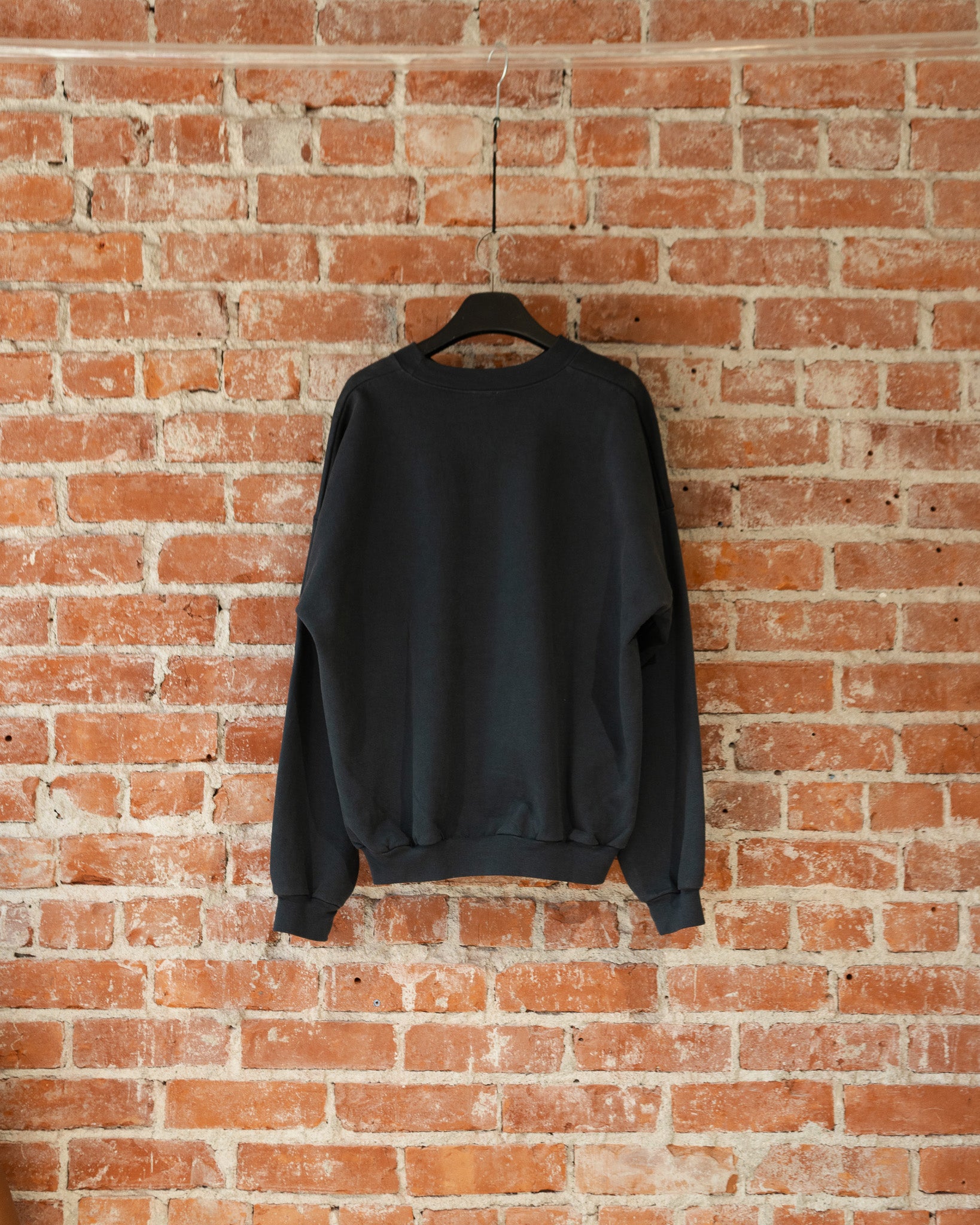 Smile Crewneck in Charcoal, back view.