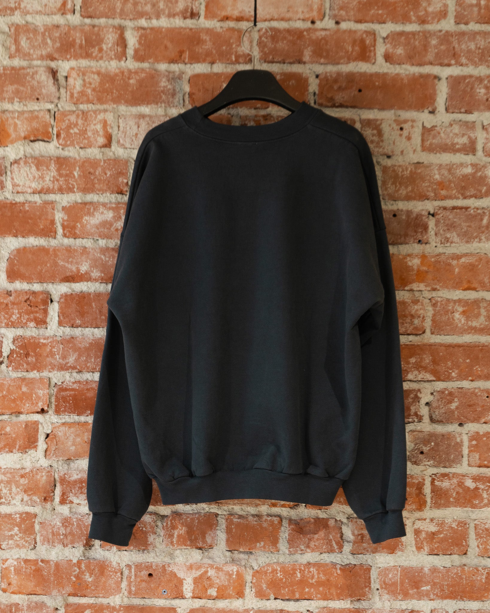 Smile Crewneck in Charcoal, closeup back view.