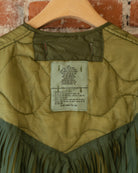 Closeup of vintage inner tag that reads size small. Height: Over 63 inches; Chest Men's: 33 to 37 inches; Chest Women's: 36 to 40 inches. Wash by hand or machine in warm water with mild soap or detergent, rinse thoroughly and drip or machine dry. DO NOT DRY CLEAN.