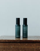 Two bottles of hinok The Spray in travel size.